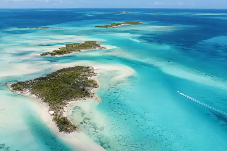 Aerial view of turquoise flats and green cays in Exuma
